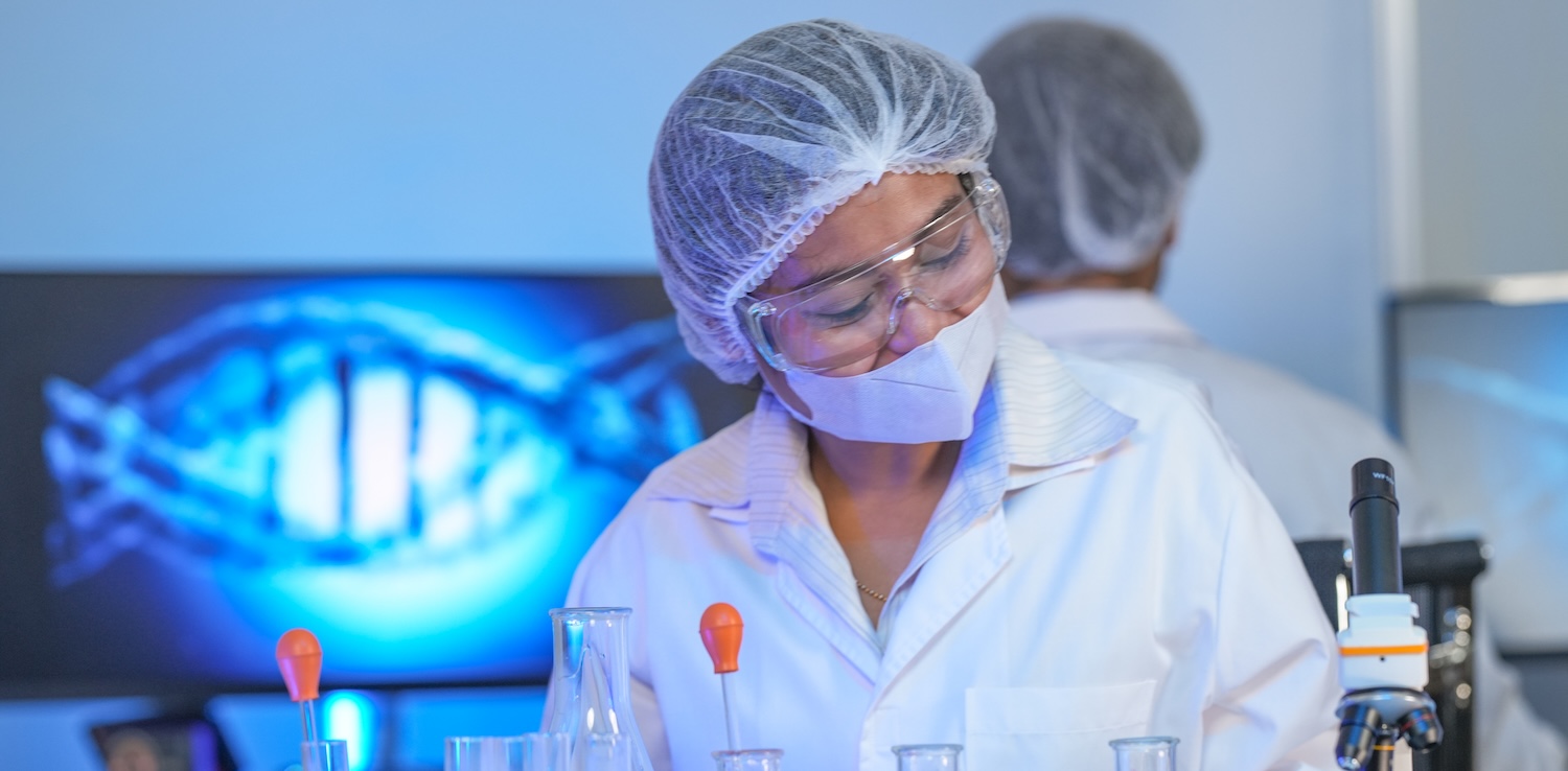 Female Scientist in protective clothing conducting resarch